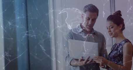 Poster - Discussing digital world map animation, man and woman using laptop in school