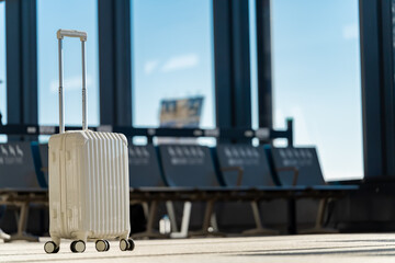 Fototapete - Travel, The suitcases in an empty airport hall, traveler cases in the departure airport terminal waiting for the area, vacation concept, blank space for text message or design