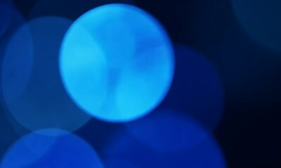 Wall Mural - Abstract blue bokeh background with soft circular shapes creating a dreamy atmosphere