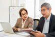 © Fahng - People, clipboard , tablet laptop and paperwork in office for planning, problem solving or budget meeting. Teamwork looking in paper for opinion, review feedback brainstorming productivity at paper