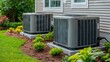 © Kateryna Kordubailo - Condenser or compressor unit located outside a home or residential building. Part of a central air conditioning (AC) or heating, ventilation, and air conditioning (HVAC) system. Features an electric f