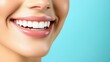 © Sweettymojidesign - Minimalist Beauty Concept of a Soft Focus Close-Up Smile with Radiant Teeth Against Blue Background