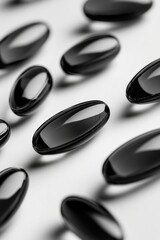 Poster - A collection of black oval magnets arranged on a clean white background, perfect for illustrations and designs