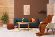 © New Africa - Stylish living room with elements in mocha mousse shade. Interior design with trendy color of 2025 year