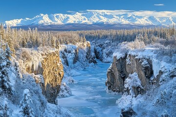 Poster - Winter view of a frozen river surrounded by snow-covered cliffs and majestic mountains in a serene landscape