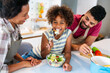 © NDABCREATIVITY - Overjoyed young african american family with kid have fun cooking at home together,