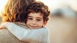 © Peter@studio5 - A joyful child hugs an adult, radiating warmth and affection against a soft, natural backdrop.