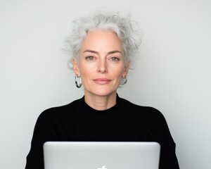 Poster - Silver-Haired Visionary Empowered Mid-Career Professional Redefining Remote Work with Sleek Apple Technology and Minimalist Elegance - Digital Transformation Embodied