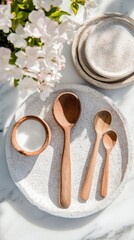 Poster - Minimalist Kitchen Artistry Handcrafted Wooden Utensils on Textured Stone Plate with Soft Floral Aesthetic - Sustainable Culinary Design and Wellness Inspiration