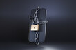 © Dragon Claws - A mobile phone locked by a metal chain and a golden padlock on a black background. Illustration of the concept of digital detox, parental control apps and phone addiction