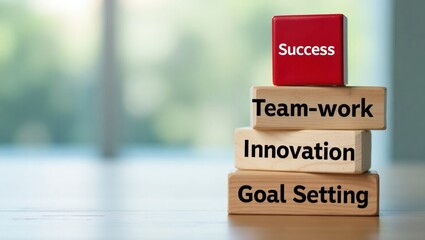 Aufkleber - success concept with wooden blocks arranged in a pyramid, each block bearing an inspirational word