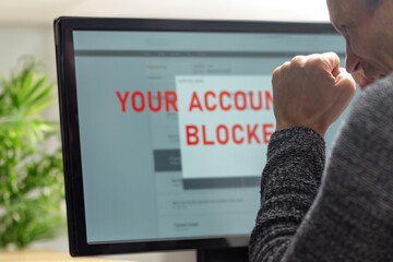 Poster - Worried young man having problems with blocked bank account. Capturing a moment of frustration, a man faces a frozen screen while managing accounts, highlighting the importance of tech solutions