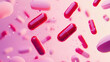 © xuan - Floating red and pink pills on pink background