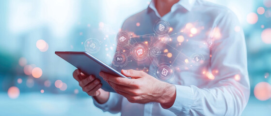 Poster - businessman holding tablet with futuristic digital interface displaying interconnected icons, symbolizing technology, communication, and innovation