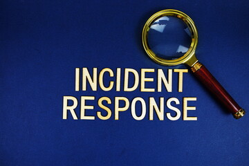Wall Mural - incident response alphabet letters with magnifying glass on navy blue background