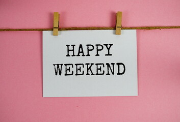 Wall Mural - happy weekend text on paper card on pink background
