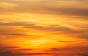 Wall Mural - beautiful bright orang sunset sky with dramatic clouds. sunset sky background.