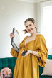 © Rikki Fletcher - Woman tossing hair holding a clipboard and walkie talkie