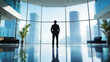 © Mirjana - Businessman reviews financial statements while standing in a modern office with a city skyline view