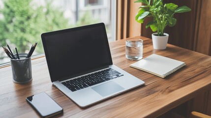 Poster - Modern desk setup with laptop, notebook, and plant in a cozy workspace