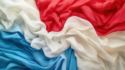 Poster - Vibrant layers of fabric in red, white, and blue create a captivating display. The soft textiles blend seamlessly, showcasing their delicate textures and colors
