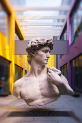 Poster - Striking Contemporary Sculpture of David in a Colorful Urban Setting