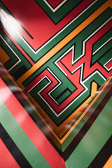 Poster - Vibrant Geometric Pattern with Rich Red, Green, and Yellow Lines