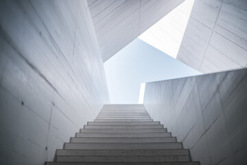 Poster - Modern Architectural Staircase Leading Towards a Bright Sky with Geometric Shapes