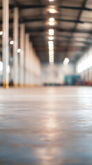 Poster - Polished concrete floor reflecting lights in a large empty warehouse with blurred industrial background