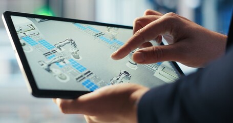 Poster - photovoltaics factory technician monitoring system performance on tablet. solar panels manufacturing