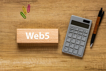 Poster - There is wood block with the word Web5. It is as an eye-catching image.