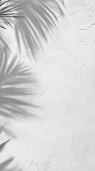 Poster - Palm leaves are casting shadows on a white textured wall, creating an elegant and tropical backdrop perfect for summer-themed designs and advertisements