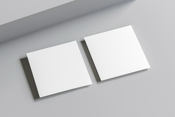 Poster - Two blank square business cards on a light gray surface with soft shadows. Ideal for branding, mockups, corporate identity, and design presentations