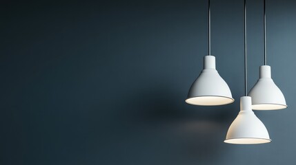 Poster - A set of three pendant lights hanging from a dark ceiling, with clean space in the background for text and graphics.