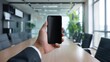 © Rachel Yee Laam Lai - hand holding a smartphone in office background mockup