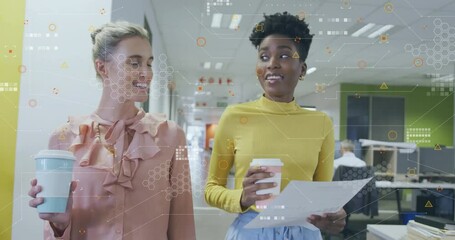 Poster - Holding coffee cups and papers, women viewing animation of digital data in office