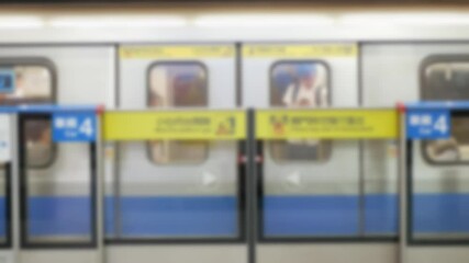 Canvas Print - out of focusing blur view to the subway train commuter's door while closing with some passenger and leaving depart from subway train platform underground station public transportation