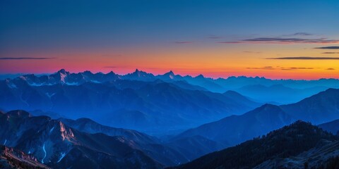 Poster - Sunrise casts vibrant colors over mountain peaks and valleys in the early morning sky