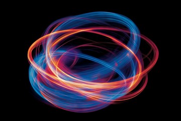 Aufkleber - Abstract light trails create a dynamic sphere in vibrant colors against a black background during a nighttime display