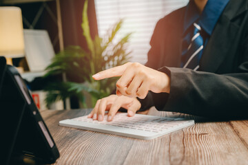 Poster - Business Professional Working on Tablet with Keyboard in Modern Office Environment, Business concept
