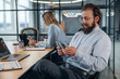 © standret - Counting money. Man and woman are in the office together