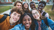 © akbar - Multiracial friends taking a big group selfie shot and smiling at the camera. Laughing young people standing outdoors and having fun - Cheerful students' portrait outside school