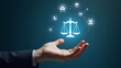 © HaJung - Flat Hand Holding Holographic Justice Symbol for Legal Services Online