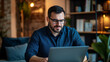 © Farid - A confident business coach, dressed casually, engages in a virtual meeting from home, using a laptop for professional training and negotiations