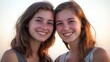 © Jolin - Two young women share a warm smile, radiating joy and connection.
