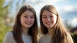 © Jolin - Two young women share a warm smile, radiating joy and connection.