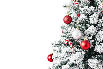 Poster - Snow-covered Christmas tree with red and silver baubles and candy canes on white background. Festive holiday decoration concept. Ai generative