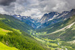 © Yuliia - Beautiful mountain landscape of the Alps in summer on tour du Montblanc area near Courmayeur village in Val Ferret valley in Italy. European Alps stunning views of green valley with colorful flowers