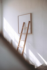 Poster - Minimalistic Wooden Ladder Leaning Against Blank Canvas in Sunlit Room