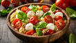 © Taufiq - Delicious pasta salad with fresh mozzarella balls, juicy cherry tomatoes, and fragrant basil leaves, served in a rustic wooden bowl.